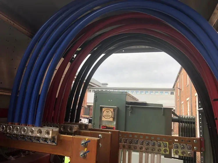 Large feeder cables arched into commercial switchgear