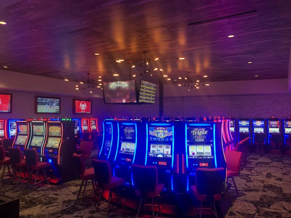 Entertainment venue floor lit with decorative ceiling fixtures and accent lighting