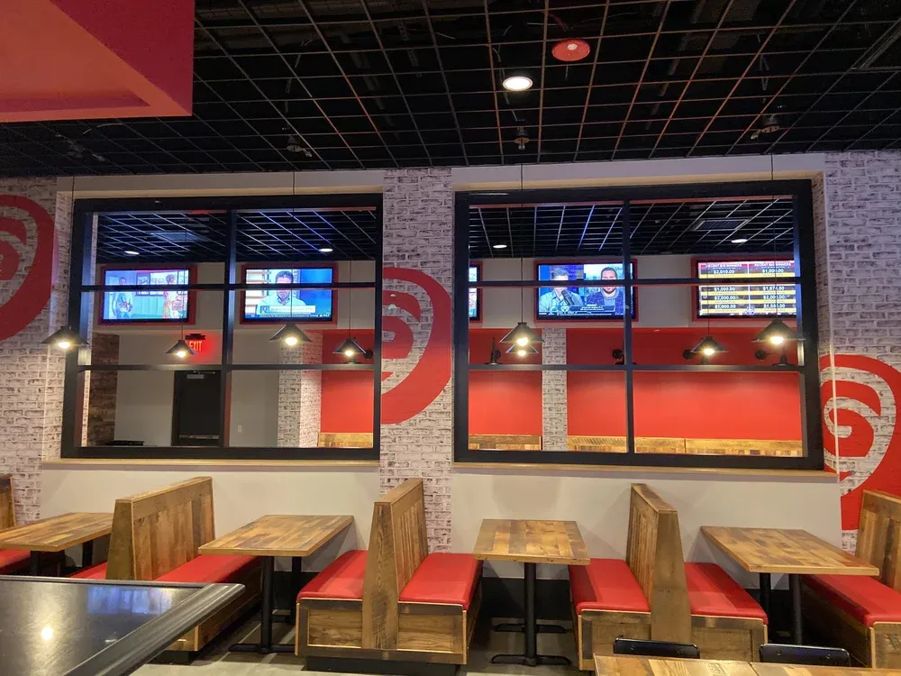 Restaurant booths and dining area under new lighting